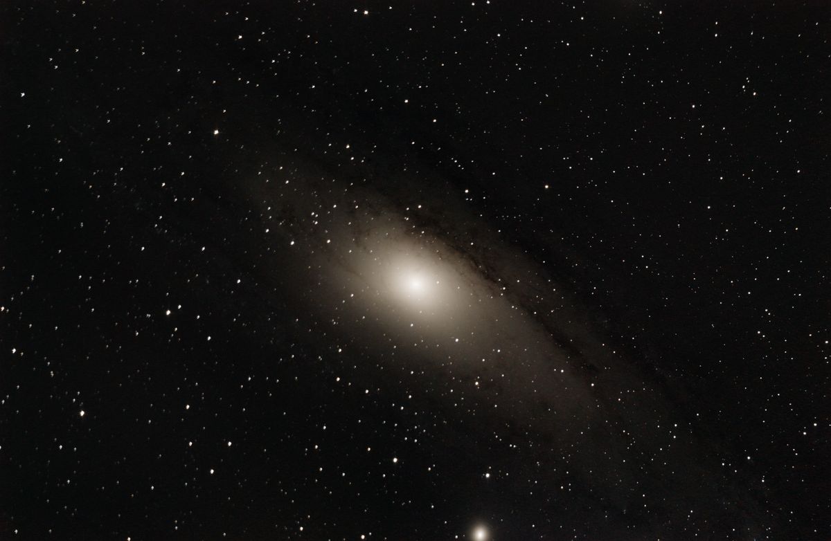 The Andromeda Galaxy (M31) with its satellite galaxy M110, a wide-field DSLR image showing the full spiral disk and dust lanes