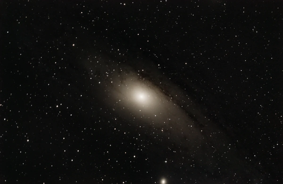 The Andromeda Galaxy (M31) with its satellite galaxy M110, a wide-field DSLR image showing the full spiral disk and dust lanes