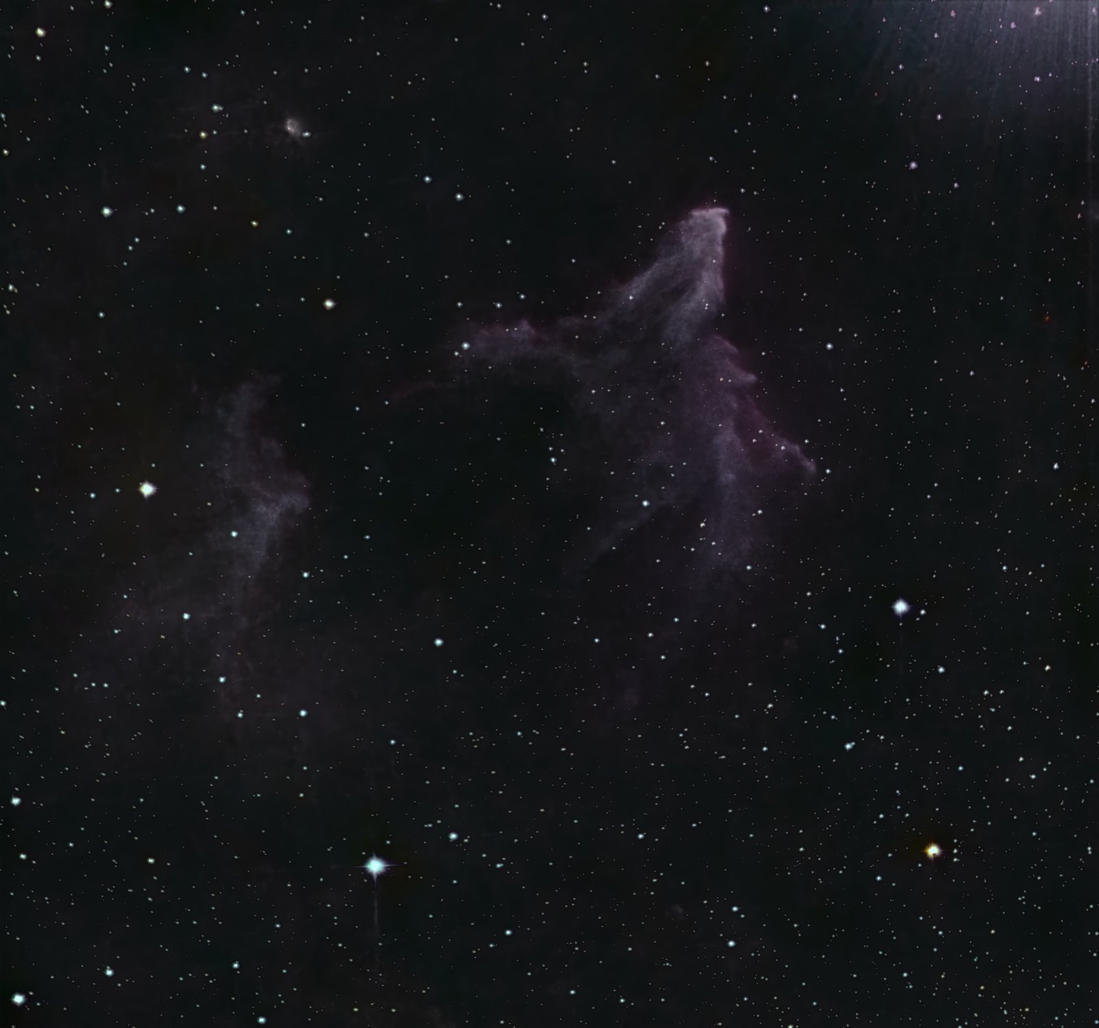 The Ghost of Cassiopeia (SH2-185 / IC 63) in LRGB &mdash; a blue reflection nebula with red Halpha rims beside gamma Cassiopeiae.
